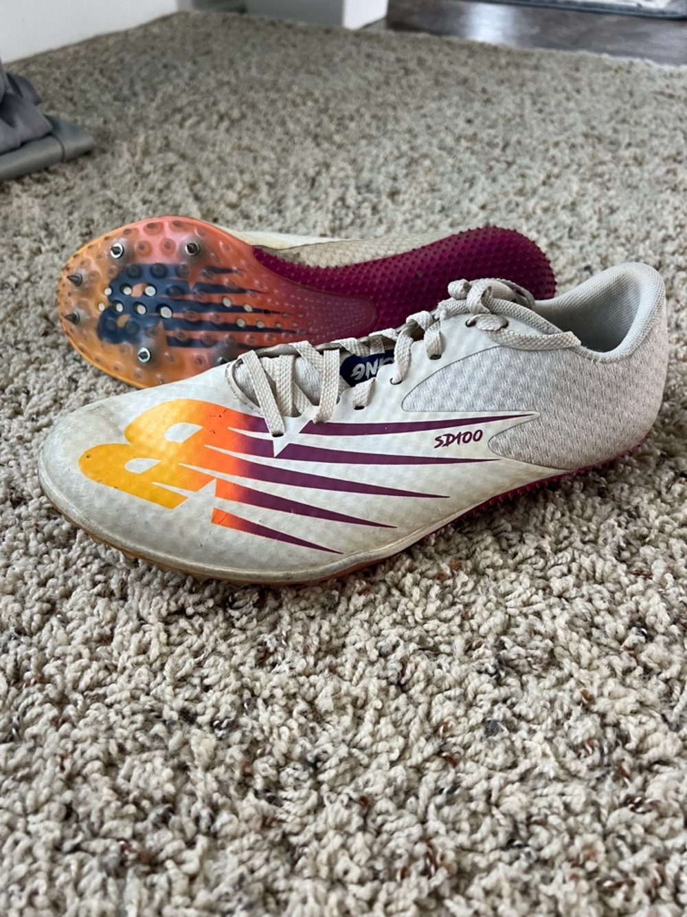 New Balance Beige Track Spikes with Orange and Purple Accents